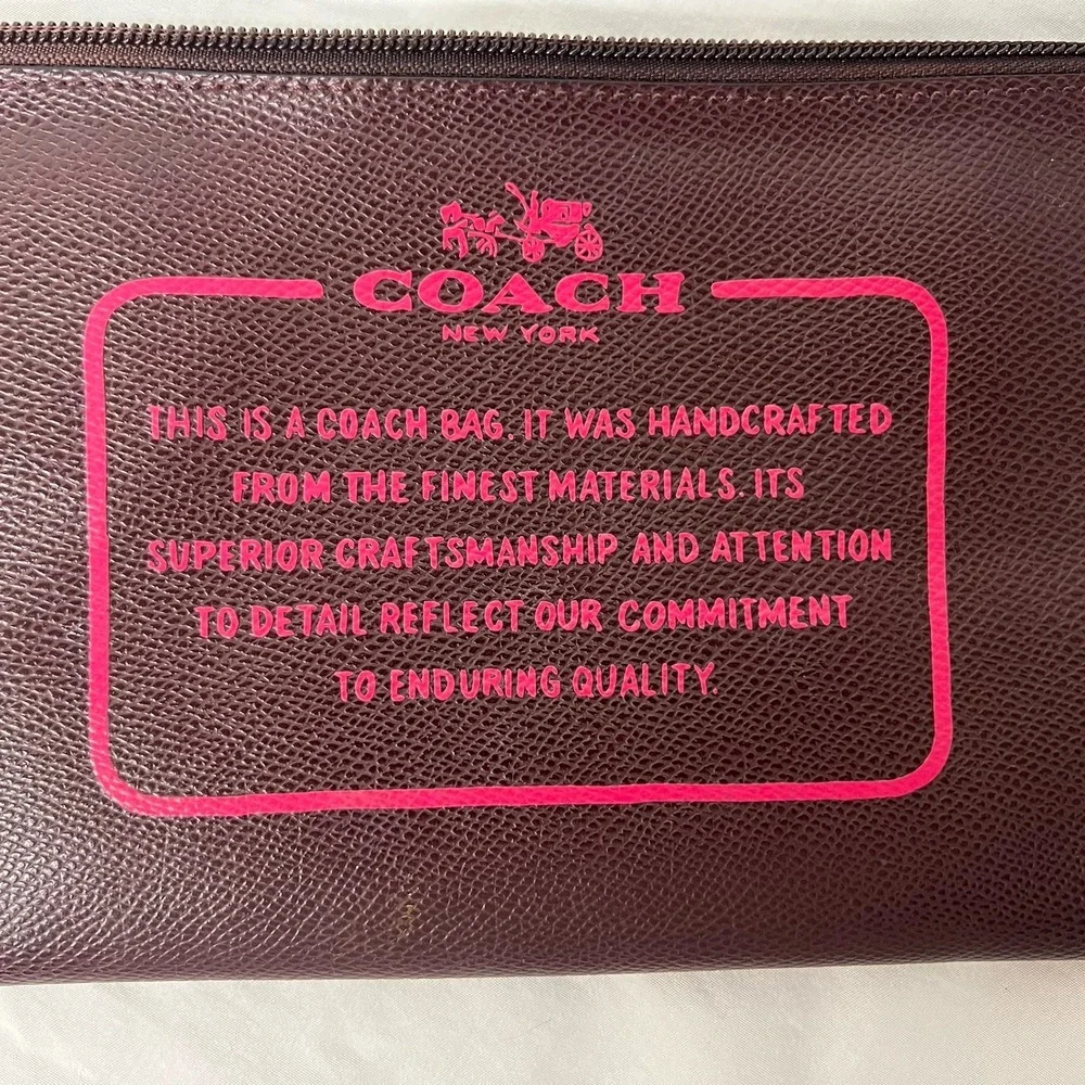 Coach Storypouch Pebbled Leather Zip Clutch Pouch Dark Burgundy Pink Creed Logo‎